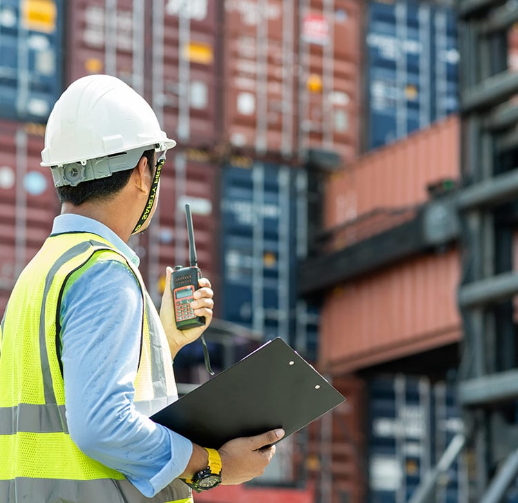Foreman control loading Containers box from Cargo freight ship for import export. Foreman control loading Containers box from Cargo freight ship for import export.