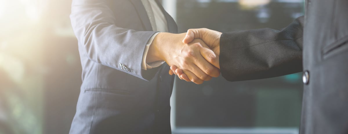 two businessmen shaking hands